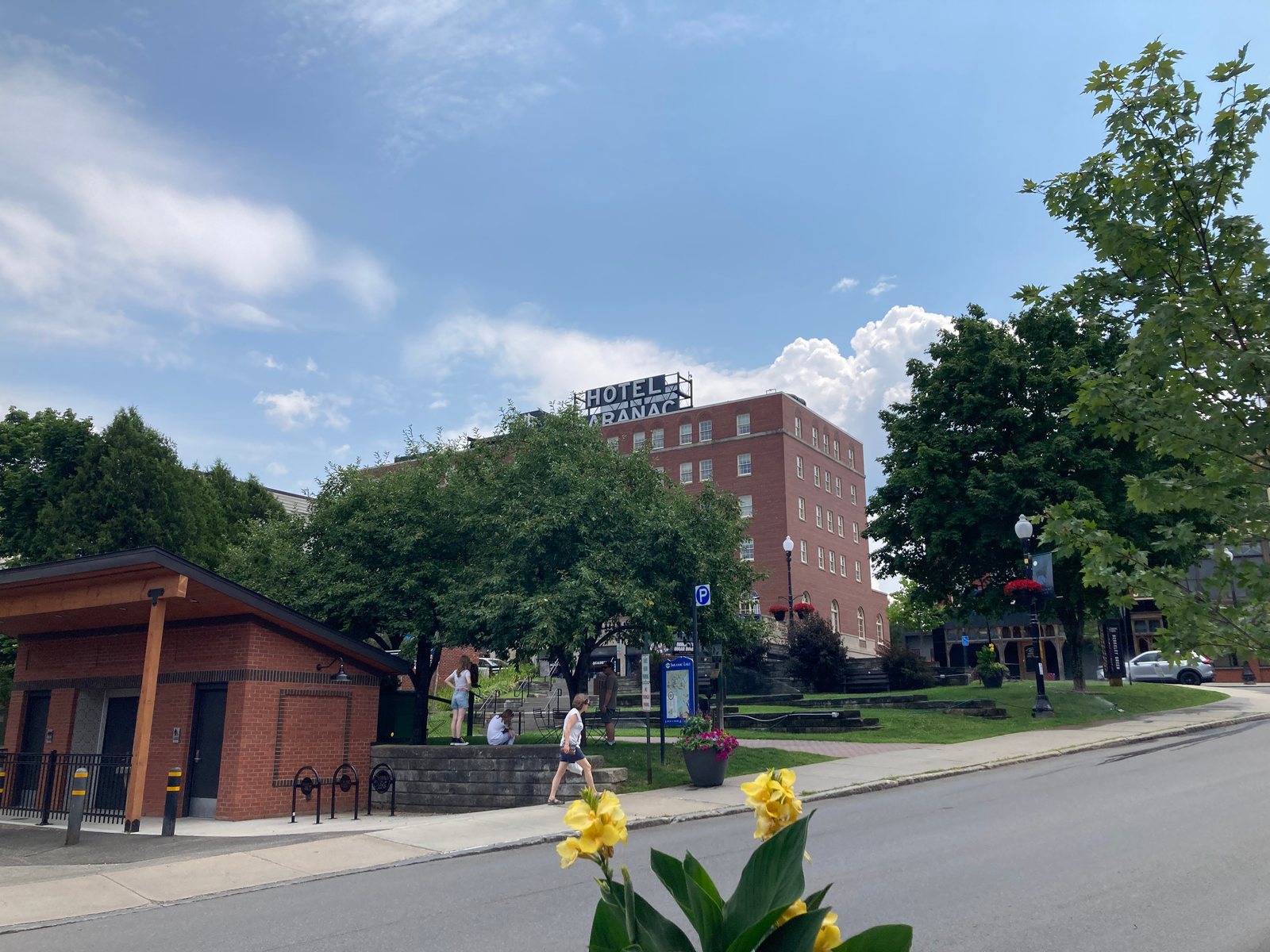 Hotel Saranac above the steps and shops on Main Street in Saranac Lake, photographed in 2025